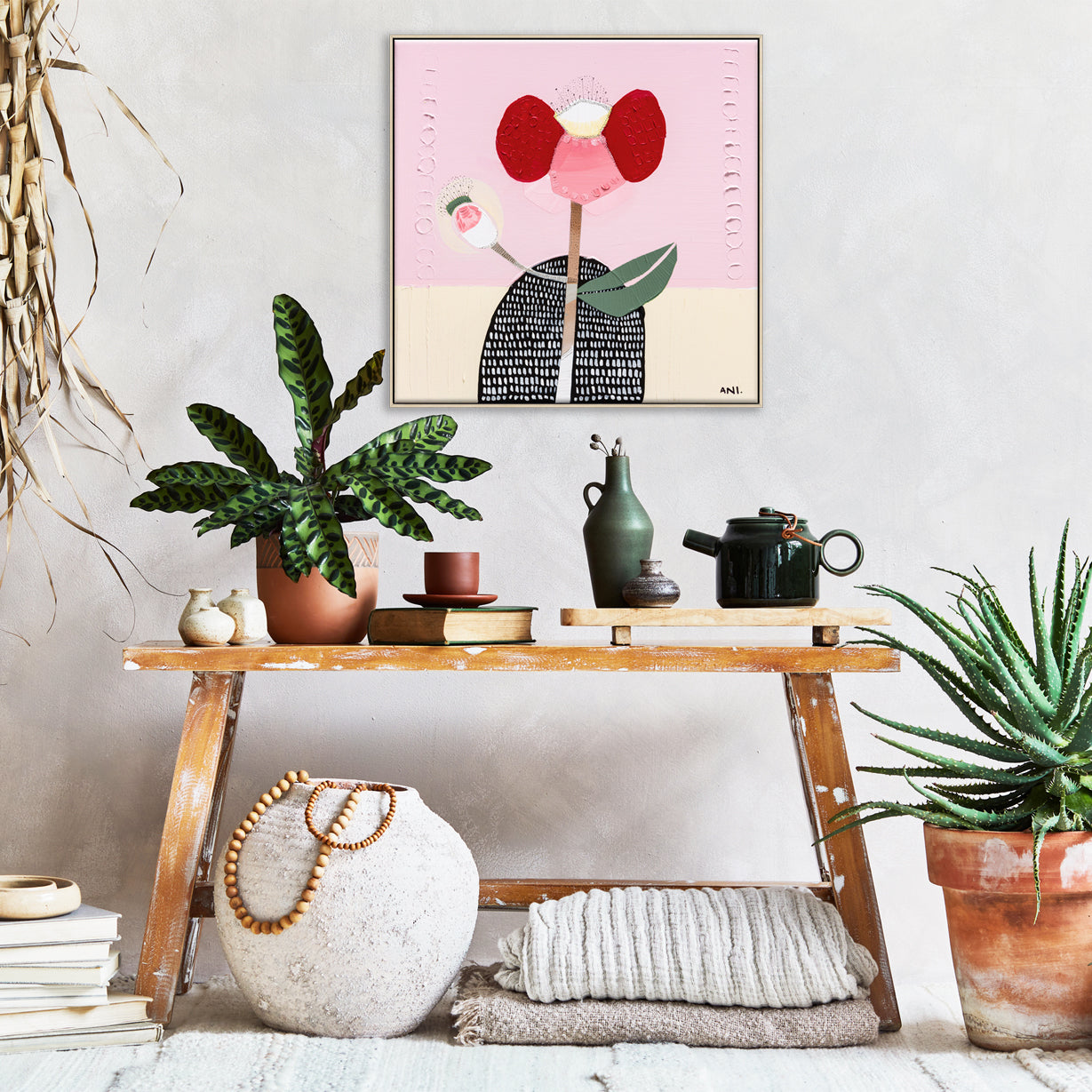 Abstract painting of a bold red poppy flower on a textured background, symbolizing strength and resilience. One petal resembles a raised arm and another curves like a hand on a hip, inspired by childhood memories. Created by Australian artist Ani Ipradjian.