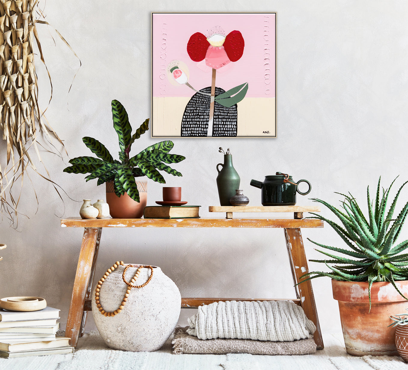 Abstract painting of a bold red poppy flower on a textured background, symbolizing strength and resilience. One petal resembles a raised arm and another curves like a hand on a hip, inspired by childhood memories. Created by Australian artist Ani Ipradjian.